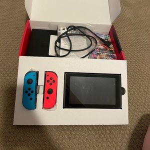 Nintendo Switch with box and Mario Kart game